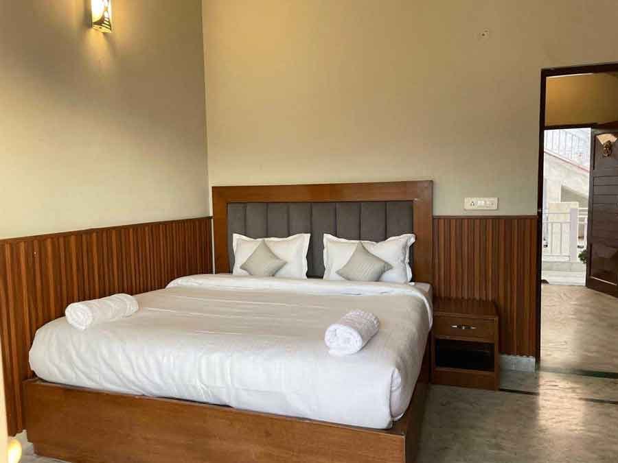 Elegant bedroom with wooden details and comfortable bedding